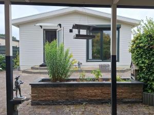 Happy Place is een modern en comfortabel chalet met een grote afgesloten tuin op de Veluwe, Recreatiepark De oude Driest