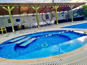 Laguna House next to Pool at Bazaleti Lake