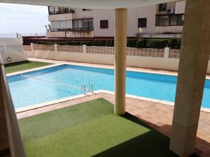 Apartment on the beach with parking and pool