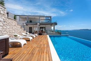 Luxurious beachfront villa Hrid with with Jacuzzi, infinity pool
