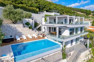 Luxurious beachfront villa Hrid with with Jacuzzi, infinity pool