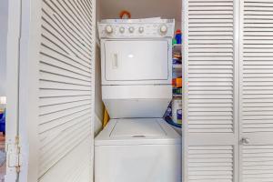 Sunlit two-story condo with pool walk one block to the beach
