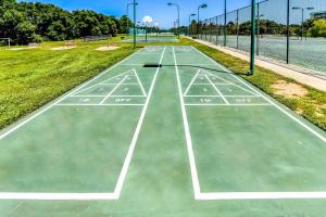 Gulf-front condo with beach access pools hot tub & sports courts