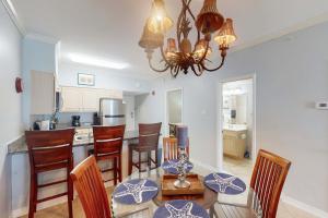 Beach-front condo with pool hot tub sauna washer dryer & grill