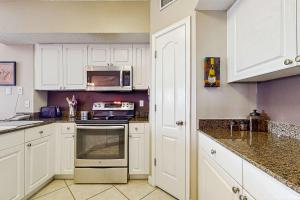 Beachfront condo with shared pool outdoor shower and beach access