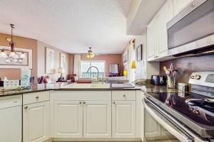 Beachfront condo with shared pool outdoor shower and beach access