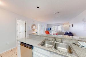Calming water view condo with full kitchen balcony pool & TV - close to park