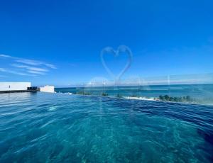 Brand-New Apartment, Walk to the Beach, Oceanview Rooftop Pool, WiFi