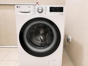 Imago Loft Suites Prime Location provide wash & dry machine water dispenser