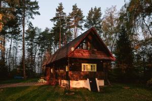 Cozy wooden cottage by the lake with a sauna