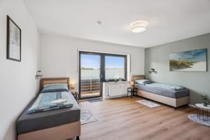 Relax24 - Hochwertiges 2-Schlafzimmer Apartment mit 4 Betten & Balkon