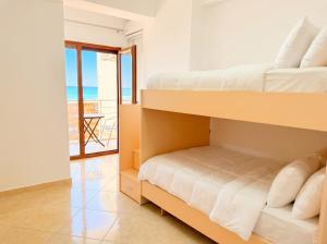 Modern 2BR Seafront Apartment with Private Parking
