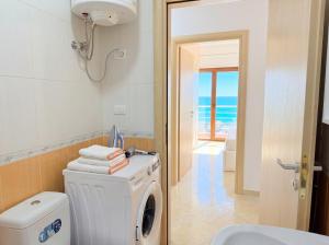 Modern 2BR Seafront Apartment with Private Parking