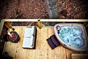 Elevated Getaway: Exclusive Tiny House with Hot Tub and Deck Views in Todd, NC