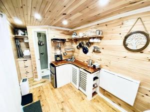 Elevated Getaway: Exclusive Tiny House with Hot Tub and Deck Views in Todd, NC