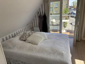 NYT! Penthouselejlighed nu med altan og havneudsigt