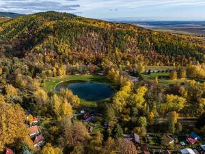 Apartment by the natural swimming pool below Krušné Mountains