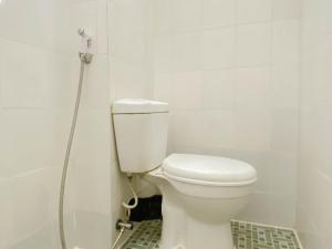 Homey and Compact 2BR Cibubur Village Apartment By Travelio