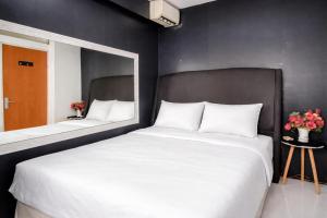 Homey and Compact 2BR Cibubur Village Apartment By Travelio