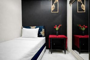 Homey and Compact 2BR Cibubur Village Apartment By Travelio
