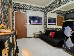 Homey and Compact 2BR Cibubur Village Apartment By Travelio
