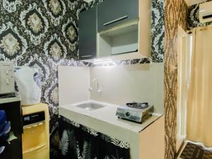 Homey and Compact 2BR Cibubur Village Apartment By Travelio