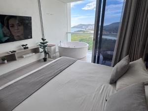Suite Lujosa con Jacuzzi piso 14 vista al mar