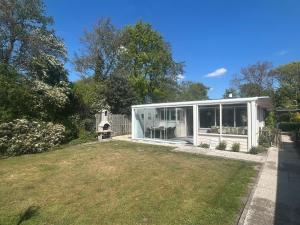 Strandnahes Nr 156 Ferienhaus mit traumhaften Wintergarten und uneinsehbaren, grossen Garten, Eckgrundstück