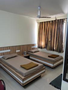 Tatva Service Apartment with AC Rooms with WiFi & Parking