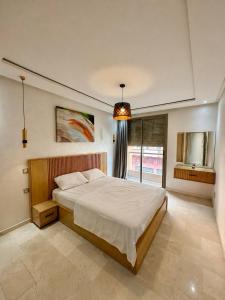RES Appartement Contemporain & Raffiné - Quartier Guéliz - Tout à Pied - Parking - Wifi - Netflix