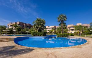 Luxury Apartment with Garden, Pool, and Golf Course