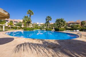 Luxury Apartment with Garden, Pool, and Golf Course