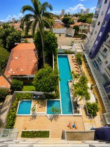 Apto premium 2Q no The Expression | Setor Bueno c piscina, Wi-Fi e garagem