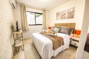 Apartamento para Casais com Opção de Café da Manhã, Aquecedor no Quarto, Netflix e Prime Video, Kit Fondue e Praia Próxima