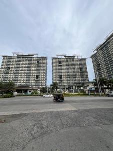 2br condo unit with two balconies that offer a picturesque ocean view and city skyline