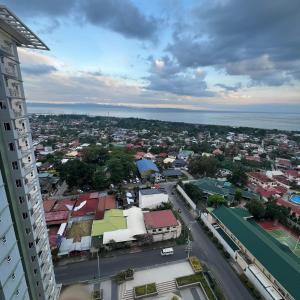 2br condo unit with two balconies that offer a picturesque ocean view and city skyline