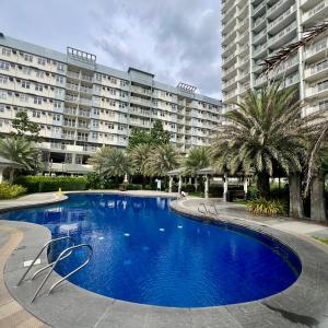 2br condo unit with two balconies that offer a picturesque ocean view and city skyline