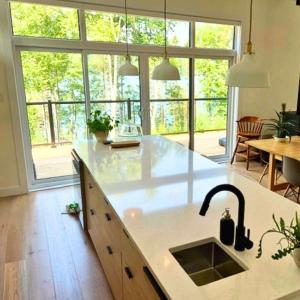 Modern Cottage on Blue Sea Lake on Cycling Route