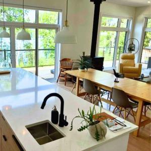 Modern Cottage on Blue Sea Lake on Cycling Route