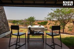 Stone House Bezze by StayVista with Lake view, Jacuzzi & Lawn - your perfect getaway