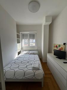 Trilocale Moderno con Terrazzo e Parcheggio