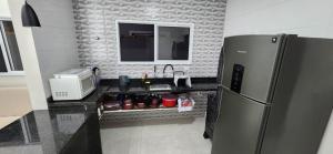 Casa com piscina, hidromassagem e área gourmet completa