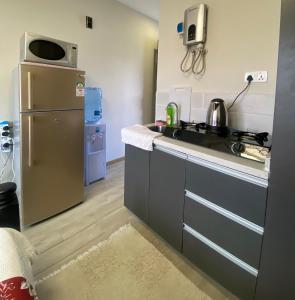 King bed Studio Apt next to 67 Airport Hotel with pool view