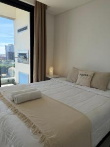Vivo Costanera frente a la playa San José de Encarnación! Apartamento de 2 Habitaciones con amenities y cochera!