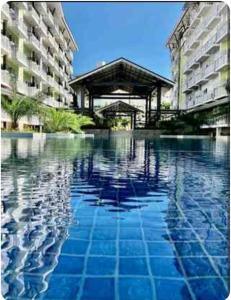 212B Amani Grand Resort Residences near Mactan Airport with pool, gym, wifi, netflix