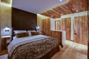 Hotels Hotel-Chalet Les Ecureuils Jardin, Piscine, Sauna : photos des chambres