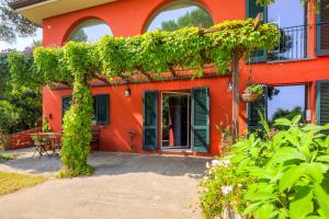 la villa rossa nestled between the hills and the sea