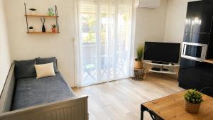 "COSY" Appartement confort de 50m2 à 150m de la Mer et du Centre ville, parking gratuit