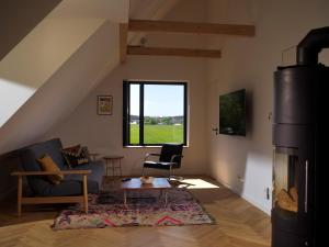 Design-Wohnung am Waldrand mit Dachterrasse und Blick auf das Achterwasser