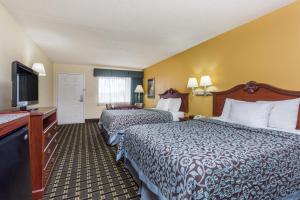 Queen Room with Two Queen Beds - Non-Smoking room in Days Inn & Suites by Wyndham Warner Robins Near Robins AFB